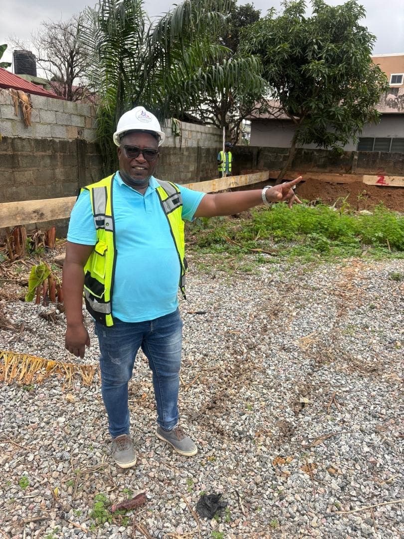 Rikonim project lead inspecting the Prime School Administration Block site at Abokobi